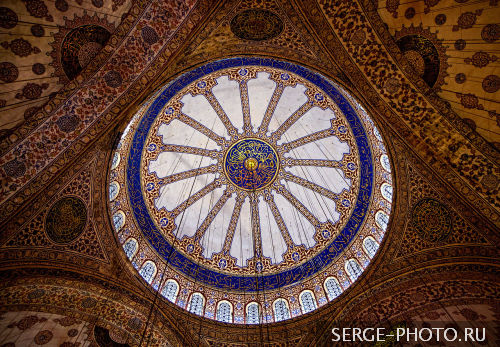 Blue Mosque

The upper levels of the interior of Blue Mosque are dominated by blue paint. More than 200 stained glass windows with intricate designs admit natural light. The decorations include verses from the Qur'an, many of them made by Seyyid Kasim Gubari, regarded as the greatest calligrapher of his time.